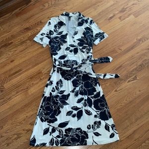 White dress with dark navy flowers and belt